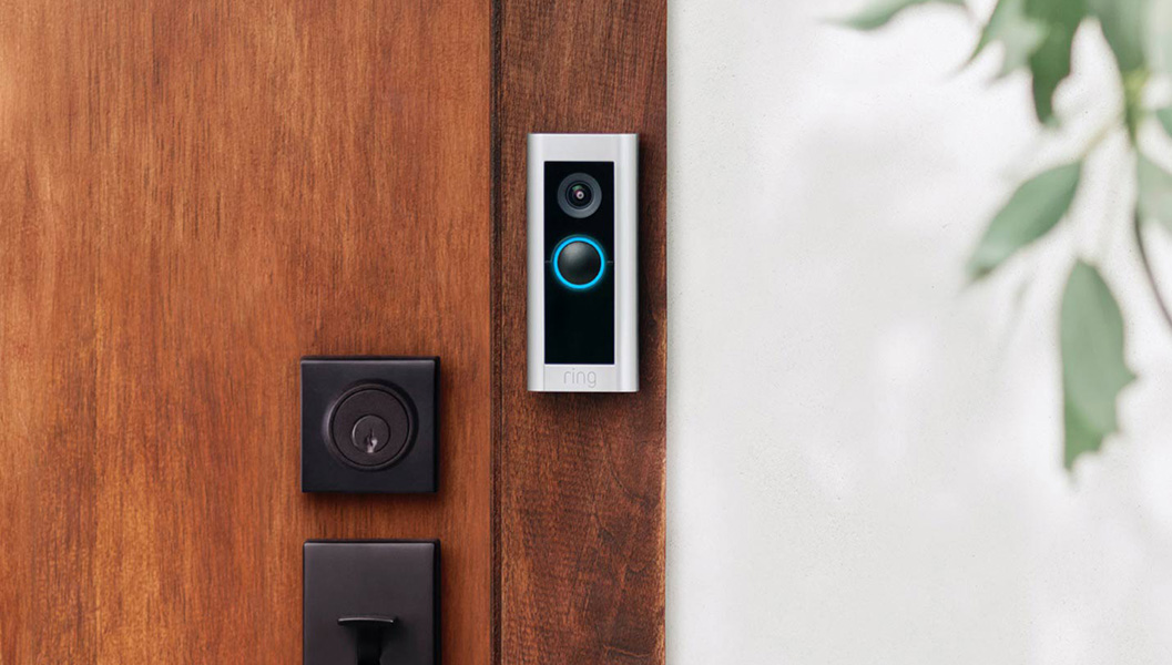 ring doorbell mounted next to wooden door