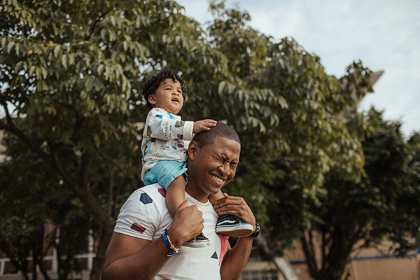 Dad with his son on his shoulders